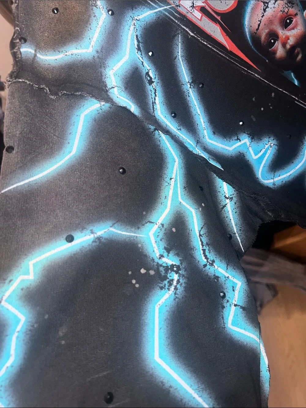 First Row Graphic Lightning Print Alien cropped shirt with rhinestones